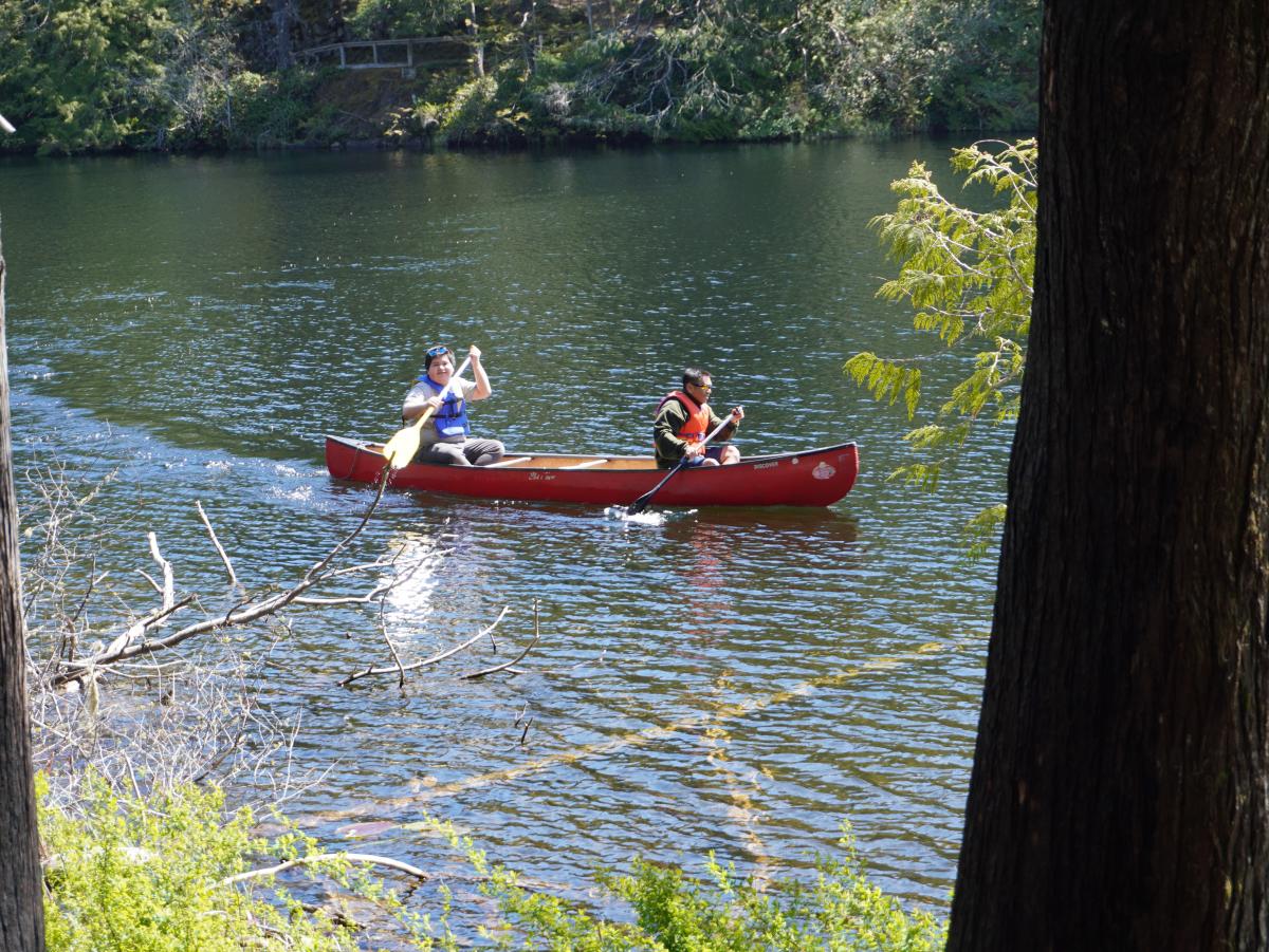 Two people in a canoe.
