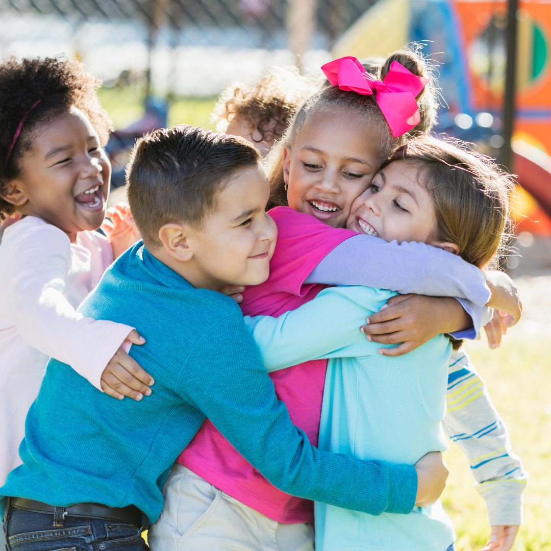 kids hugging on playground